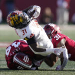 
              Maryland running back Antwain Littleton II (31) is tackled by Indiana's Kaiden Turner (14) and Bryant Fitzgerald (31) during the first half of an NCAA college football game, Saturday, Oct. 15, 2022, in Bloomington, Ind. (AP Photo/Darron Cummings)
            