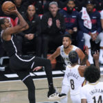 
              Brooklyn Nets' Kevin Durant shoots over New Orleans Pelicans' Naji Marshall (8), Brandon Ingram (14) and CJ McCollum during the first half of an NBA basketball game Wednesday, Oct. 19, 2022, in New York. (AP Photo/Frank Franklin II)
            
