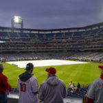 
              Fans arrive for Game 3 of baseball's World Series between the Houston Astros and the Philadelphia Phillies on Monday, Oct. 31, 2022, in Philadelphia. The game was postponed by rain Monday night with the matchup tied 1-1. (AP Photo/Matt Rourke)
            