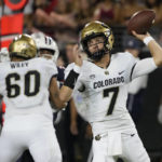 
              Colorado quarterback Owen McCown (7) throws a pass against Arizona during the first half of an NCAA college football game Saturday, Oct. 1, 2022, in Tucson, Ariz. (AP Photo/Rick Scuteri)
            