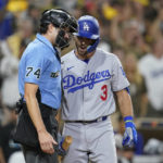 
              Los Angeles Dodgers' Chris Taylor has a word with home plate umpire John Tumpane after striking out during the sixth inning in Game 4 of a baseball NL Division Series against the San Diego Padres, Saturday, Oct. 15, 2022, in San Diego. (AP Photo/Ashley Landis)
            