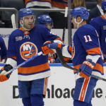 
              New York Islanders center Kyle Palmieri (21) celebrates with left wing Zach Parise (11) after scoring on New York Rangers goaltender Jaroslav Halak (41) in the second period of an NHL hockey game, Wednesday, Oct. 26, 2022, in Elmont, N.Y. (AP Photo/John Minchillo)
            