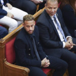 
              Former FC Barcelona player Neymar who now plays for Paris Saint-Germain, left, sits with his father, Neymar Da Silva Santos in court in Barcelona, Spain, Monday Oct. 17, 2022. Neymar is in court to face a trial over alleged irregularities involving his transfer to Barcelona in 2013. Neymar's parents, former Barcelona president Sandro Rosell and representatives for both the Spanish club and Brazilian team Santos are also in court after a complaint brought by Brazilian investment group DIS regarding the amount of the player's transfer. All defendants have denied wrongdoing. (AP Photo/Joan Mateu Parra)
            