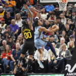 
              Memphis Grizzlies guard Kennedy Chandler (1) goes to the basket as Utah Jazz guard Jordan Clarkson (00) defends during the first half of an NBA basketball game, Monday, Oct. 31, 2022, in Salt Lake City. (AP Photo/Rick Bowmer)
            