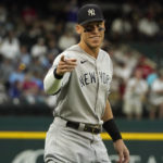 
              New York Yankees' Aaron Judge points to fans during warm ups before the second baseball game of a doubleheader against the Texas Rangers in Arlington, Texas, Tuesday, Oct. 4, 2022. (AP Photo/LM Otero)
            
