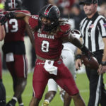 
              South Carolina running back Christian Beal-Smith (8) pumps his fist after a first down run during the first half of the team's NCAA college football game against Texas A&M on Saturday, Oct. 22, 2022, in Columbia, S.C. (AP Photo/Artie Walker Jr.)
            
