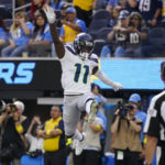 
              Seattle Seahawks wide receiver Marquise Goodwin (11) celebrates after scoring a touchdown during the first half of an NFL football game against the Los Angeles Chargers Sunday, Oct. 23, 2022, in Inglewood, Calif. (AP Photo/Mark J. Terrill)
            