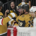 
              Vegas Golden Knights center Paul Cotter, center, celebrates after scoring against the Chicago Blackhawks during the second period of an NHL hockey game Thursday, Oct. 13, 2022, in Las Vegas. (AP Photo/John Locher)
            
