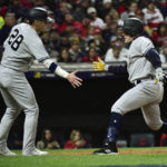 
              New York Yankees' Harrison Bader, right, celebrates with teammate Josh Donaldson (28) after hitting a home run in the second inning of Game 4 of a baseball AL Division Series against the Cleveland Guardians, Sunday, Oct. 16, 2022, in Cleveland. (AP Photo/Phil Long)
            