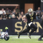 
              New Orleans Saints' Taysom Hill breaks the tackle of Seattle Seahawks safety Quandre Diggs and heads to the end zone for a 60 yard rushing touchdown during an NFL football game in New Orleans, Sunday, Oct. 9, 2022. (AP Photo/Gerald Herbert)
            