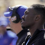 
              Kansas quarterback Jalon Daniels watches from the sidelines after during the second half of an NCAA college football game against TCU after coming out of the game with an injury during the first half Saturday, Oct. 8, 2022, in Lawrence, Kan. TCU won 38-31. (AP Photo/Charlie Riedel)
            