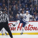 
              Toronto Maple Leafs' David Kampf (64) celebrates his goal against the Winnipeg Jets during the second period of an NHL hockey game Saturday, Oct. 22, 2022, in Winnipeg, Manitoba. (John Woods/The Canadian Press via AP)
            