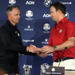 
              United States Captain Zach Johnson, right, and European Captain Luke Donald shake hands before a press conference on the occasion of The Year to Go event in Rome, Tuesday, Oct. 4, 2022. The Marco Simone course of Guidonia Montecelio, near Rome, will host the 2023 Ryder Cup. (AP Photo/Alessandra Tarantino)
            