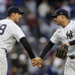 
              New York Yankees pitcher Jacob Barnes (68) and Gleyber Torres celebrate after a baseball game against the Baltimore Orioles on Saturday, Oct. 1, 2022, in New York. The Yankees won 8-0. (AP Photo/Adam Hunger)
            