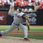 
              Philadelphia Phillies starting pitcher Zack Wheeler throws during the third inning in Game 1 of a National League wild card baseball playoff series against the St. Louis Cardinals, Friday, Oct. 7, 2022, in St. Louis. (AP Photo/Scott Kane)
            