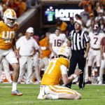 
              Tennessee place kicker Chase McGrath (40) readies to kick a last second field goal as holder Paxton Brooks (37) waits to snap during the second half of an NCAA college football game against Alabama Saturday, Oct. 15, 2022, in Knoxville, Tenn. Tennessee won 52-49. (AP Photo/Wade Payne)
            