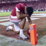 
              FILE - Alabama quarterback Bryce Young (9) kneels in the end zone seconds before kickoff before the first half of an NCAA college football game against Texas A&M, Saturday, Oct. 8, 2022, in Tuscaloosa, Ala. Young was selected the biggest injury in the Associated Press SEC Midseason Awards, Wednesday, Oct. 12, 2022. (AP Photo/Vasha Hunt, File)
            