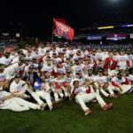
              The Philadelphia Phillies pose after winning the baseball NL Championship Series against the San Diego Padres in Game 5 on Sunday, Oct. 23, 2022, in Philadelphia. (AP Photo/Matt Slocum)
            