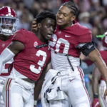 
              Alabama defensive back Earl Little II (20) celebrates with defensive back Terrion Arnold (3) after a win over Texas A&M in an NCAA college football game Saturday, Oct. 8, 2022, in Tuscaloosa, Ala. (AP Photo/Vasha Hunt)
            