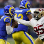 
              San Francisco 49ers defensive end Drake Jackson, right, attempts to sack Los Angeles Rams quarterback Matthew Stafford during the second half of an NFL football game Sunday, Oct. 30, 2022, in Inglewood, Calif. (AP Photo/Gregory Bull)
            