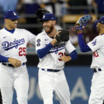 
              Los Angeles Dodgers' Trayce Thompson (25) Cody Bellinger, center, and Mookie Betts celebrate a 6-4 win over the Colorado Rockies during a baseball game Saturday, Oct. 1, 2022, in Los Angeles. (AP Photo/Marcio Jose Sanchez)
            