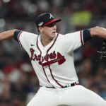 
              Atlanta Braves starting pitcher Kyle Wright (30) works during the sixth inning in Game 2 of baseball's National League Division Series between the Atlanta Braves and the Philadelphia Phillies, Wednesday, Oct. 12, 2022, in Atlanta. (AP Photo/John Bazemore)
            