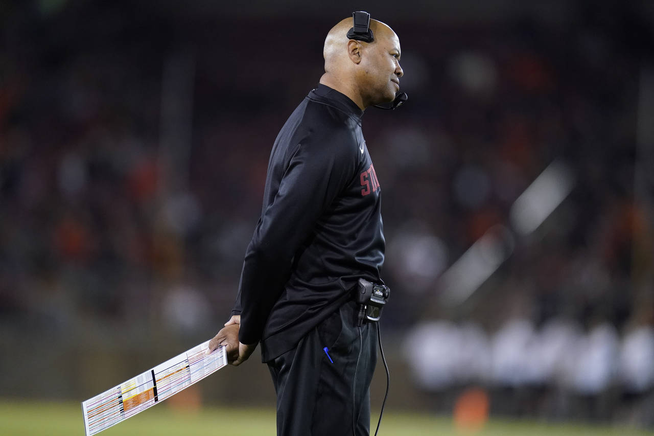 Stanford head coach David Shaw listens to a call by the referee during the first half of the team's...