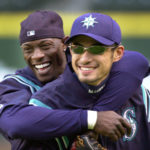 
              FILE - Seattle Mariners' Mike Cameron, left, embraces teammate Ichiro Suzuki during their workout Monday, Oct. 8, 2001, in Seattle. An entire generation has waited for the Seattle Mariners to bring playoff baseball back to the Pacific Northwest. After a 21-year absence, the postseason is back in Seattle for Game 3 of the ALDS against Houston. (AP Photo/Elaine Thompson, File)
            