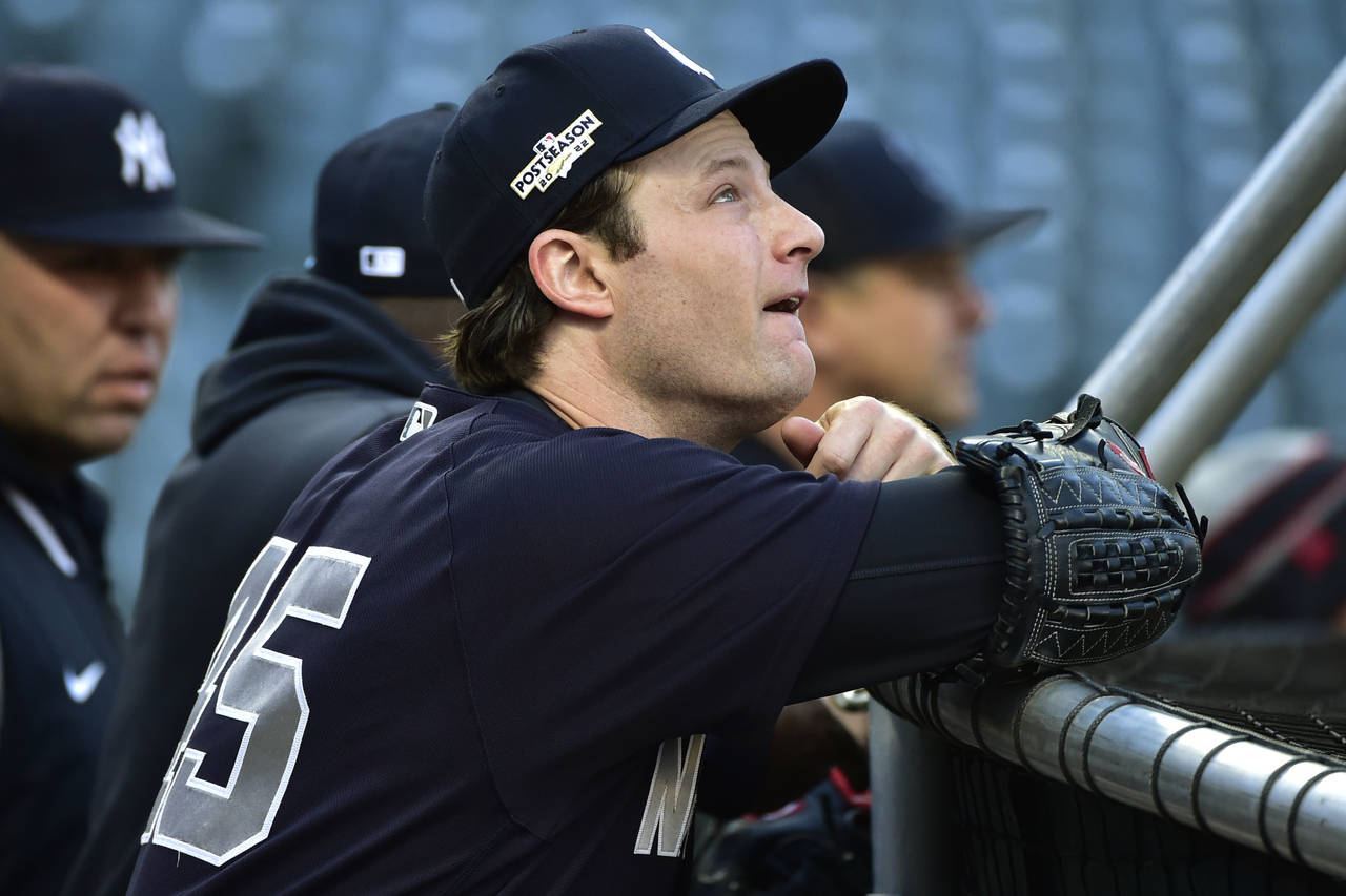 New York Yankees pitcher Gerrit Cole (45) watches batting practice before Game 3 of the baseball te...