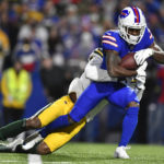 
              Buffalo Bills wide receiver Isaiah McKenzie (6) is tackled by Green Bay Packers cornerback Rasul Douglas (29) during the first half of an NFL football game Sunday, Oct. 30, 2022, in Orchard Park. (AP Photo/Adrian Kraus)
            