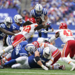 
              Indianapolis Colts running back Jonathan Taylor is tackled by Kansas City Chiefs linebacker Nick Bolton (32) on a fourth down during the second half of an NFL football game, Sunday, Sept. 25, 2022, in Indianapolis. Taylor was stopped short of the first down. (AP Photo/Michael Conroy)
            