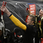 
              Portland Thorns FC goalkeeper Bella Bixby, in yellow, and others celebrate in the locker room after the NWSL championship soccer match against the Kansas City Current, Saturday, Oct. 29, 2022, in Washington. Portland won 2-0. (AP Photo/Nick Wass)
            