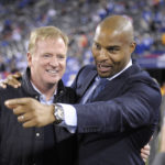 
              FILE - Former New York Giants defensive end Osi Umenyiora, right, talks with NFL commissioner Roger Goodell before an NFL football game between the New York Giants and the San Francisco 49ers, Sunday, Oct. 11, 2015, in East Rutherford, N.J. Umenyiora was born in London but grew up in Nigeria and is one of the NFL’s leading ambassadors now for growing the game in Africa. (AP Photo/Bill Kostroun, File)
            