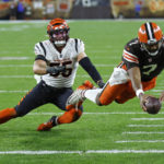 
              Cleveland Browns quarterback Jacoby Brissett (7) dives into the end zone for a touchdown with Cincinnati Bengals linebacker Logan Wilson (55) defending during the second half of an NFL football game in Cleveland, Monday, Oct. 31, 2022. (AP Photo/Ron Schwane)
            