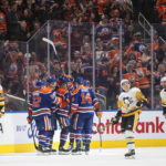
              Edmonton Oilers players celebrate a goal against the Pittsburgh Penguins during third-period NHL hockey game action in Edmonton, Alberta, Monday, Oct. 24, 2022. (Jason Franson/The Canadian Press via AP)
            