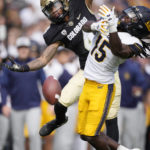 
              Colorado wide receiver Jordyn Tyson, left, loses control of a pass as California cornerback Lu-Magia Hearns III defends in the first half of an NCAA college football game in Folsom Field Saturday, Oct. 15, 2022, in Boulder, Colo. (AP Photo/David Zalubowski)
            