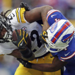 
              Pittsburgh Steelers running back Najee Harris is tackled by Buffalo Bills safety Jaquan Johnson during the second half of an NFL football game in Orchard Park, N.Y., Sunday, Oct. 9, 2022. (AP Photo/Joshua Bessex)
            