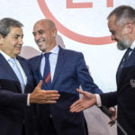 
              Portuguese Soccer Federation President Fernando Gomes, left, President of the Spanish Royal Federation of Soccer (RFEF), Luis Rubiales, center, Ukrainian Football Federation President Andriy Pavelko, right, shake hands during a press conference about the announcing that Ukraine is joining Spain and Portugal in their joint bid to host the World Cup in 2030, at the UEFA Headquarters, in Nyon, Switzerland, Wednesday, October 5, 2022. The proposal harnesses the idea that football can restore hope and peace, while Ukraine has been at war with Russia for months.  (Martial Trezzini/Keystone via AP)
            