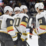 
              The Vegas Golden Knights celebrate center Nicolas Roy (10) goal against the Anaheim Ducks during the second period of an NHL hockey game Friday, Oct. 28, 2022, in Las Vegas. (AP Photo/David Becker)
            