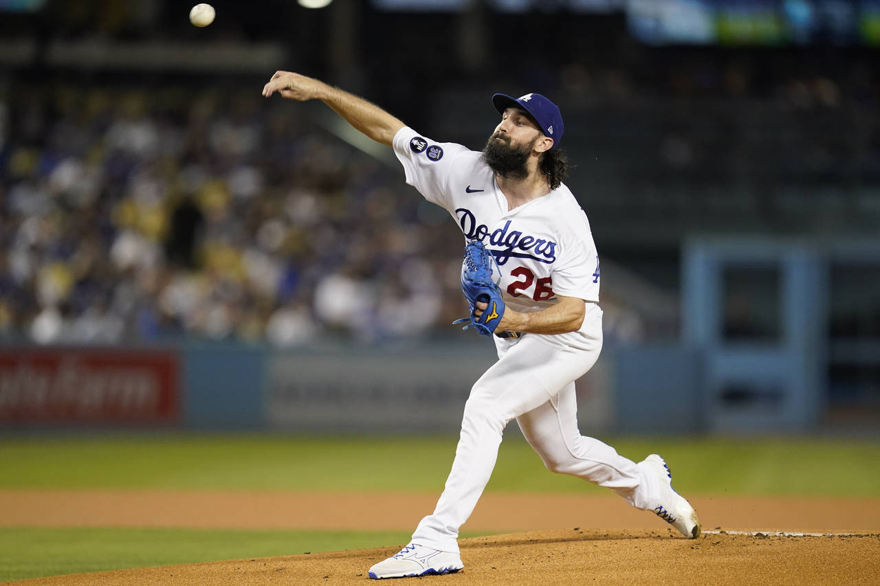 Los Angeles Dodgers starting pitcher Tony Gonsolin (26) throws during the first inning of a basebal...