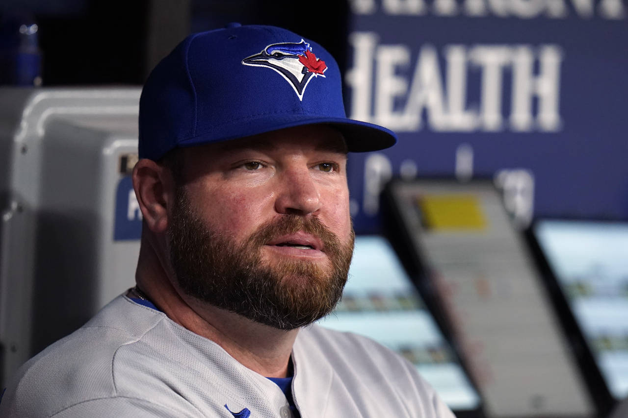 FILE - Toronto Blue Jays interim manager John Schneider looks on from the dugout during the first i...