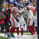 
              New York Giants running back Saquon Barkley (26) celebrates a touchdown during the second half of an NFL football game against the Green Bay Packers at the Tottenham Hotspur stadium in London, Sunday, Oct. 9, 2022. (AP Photo/Alastair Grant)
            