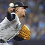 
              Seattle Mariners starting pitcher Luis Castillo throws against the Toronto Blue Jays during the third inning Game 1 in an AL wild-card baseball playoff series in Toronto on Friday, Oct. 7, 2022. (Nathan Denette/The Canadian Press via AP)
            