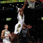 
              Indiana Pacers guard Buddy Hield (24) dunks against Brooklyn Nets forward Royce O'Neale (00) during the first half of an NBA basketball game Monday, Oct. 31, 2022, in New York. (AP Photo/Jessie Alcheh)
            