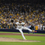 
              San Diego Padres relief pitcher Josh Hader works against a Los Angeles Dodgers batter during the ninth inning in Game 3 of a baseball NL Division Series, Friday, Oct. 14, 2022, in San Diego. (AP Photo/Jae C. Hong)
            