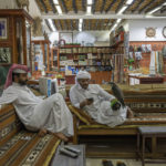 
              Salesmen sit in their falcon shop in Souq Waqif, Doha, Qatar, Sunday, Oct. 16, 2022. (AP Photo/Nariman El-Mofty)
            