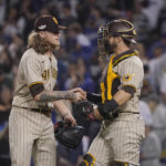 
              San Diego Padres relief pitcher Josh Hader, left, shakes hands with catcher Austin Nola after a 5-3 in over the Los Angeles Dodgers during Game 2 of a baseball NL Division Series, Wednesday, Oct. 12, 2022, in Los Angeles. (AP Photo/Mark J. Terrill)
            