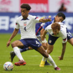 
              FILE - United States Tyler Adams, left, and United States Joshua Sargent, right, playing during the international friendly soccer match between USA and Japan as part of the Kirin Challenge Cup in Duesseldorf, Germany, Friday, Sept. 23, 2022. (AP Photo/Martin Meissner, File)
            
