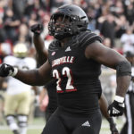 
              Louisville linebacker Yasir Abdullah (22) celebrates after recovering a fumble during the second half of an NCAA college football game against Wake Forest in Louisville, Ky., Saturday, Oct. 29, 2022. (AP Photo/Timothy D. Easley)
            