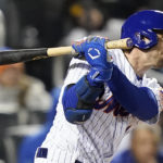 
              New York Mets Jeff McNeil (1) connects for a two-run double against the San Diego Padres during the seventh inning of Game 2 of a National League wild-card baseball playoff series, Saturday, Oct. 8, 2022, in New York. (AP Photo/John Minchillo)
            